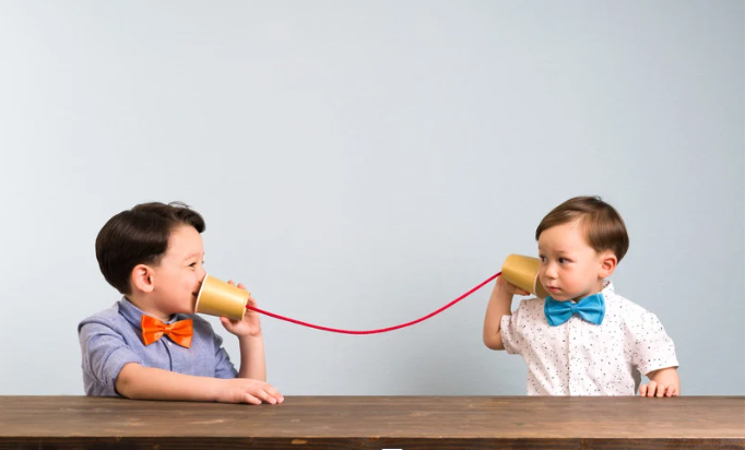 Two children practicing communication through play